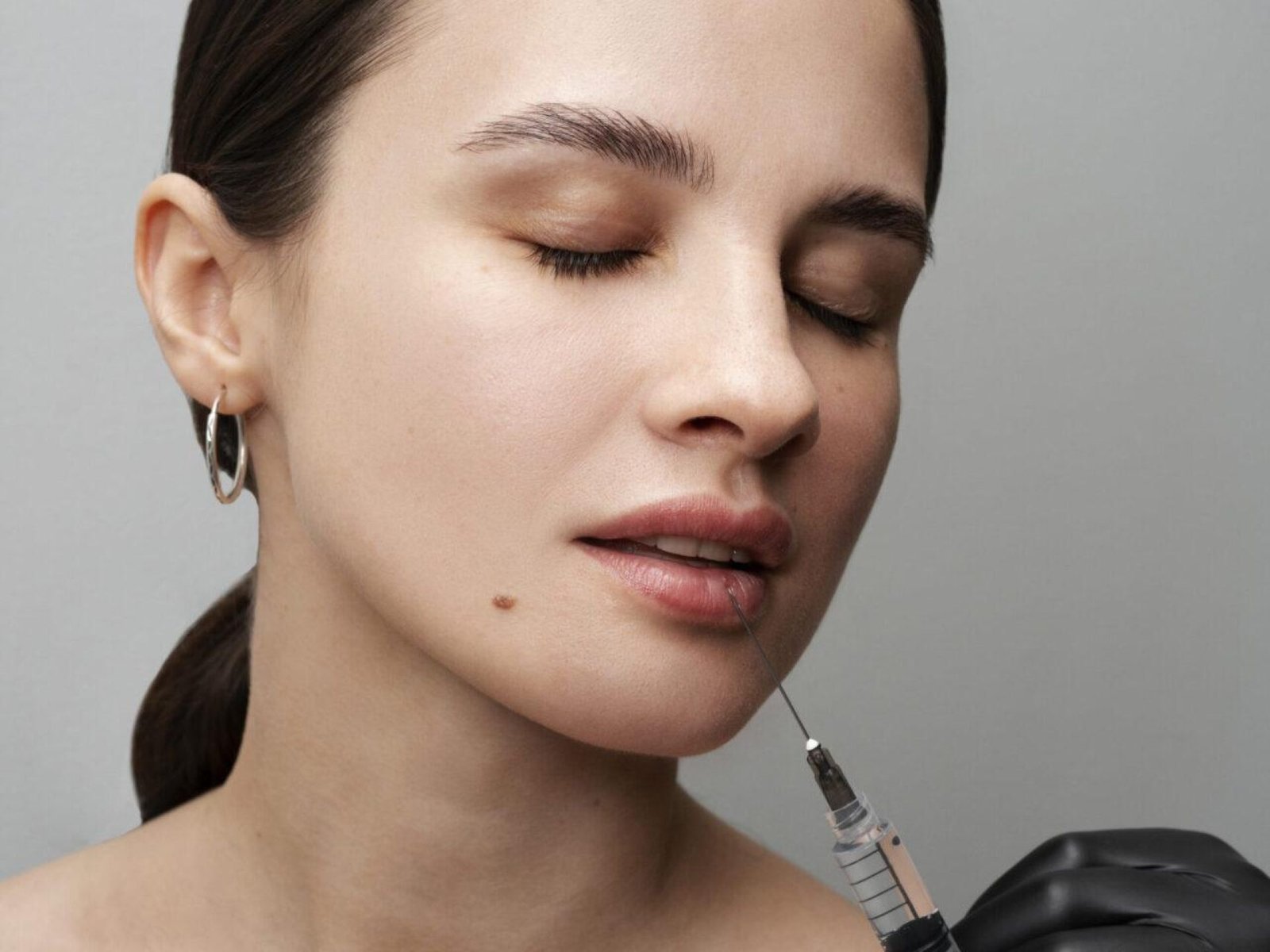 young-woman-getting-lip-fillers-clinic